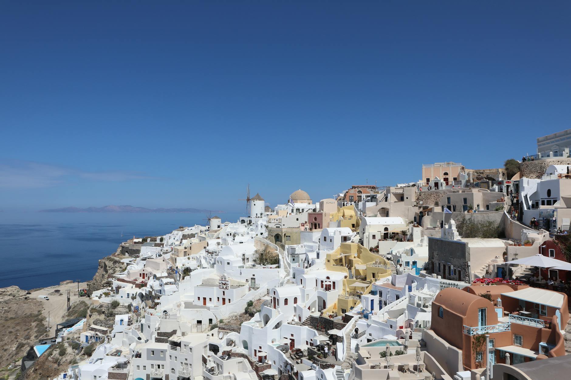 White Cycladic village above the Aegean