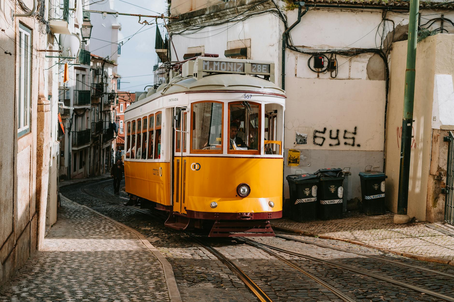 Yellow trams climb Alfama, Lisbon